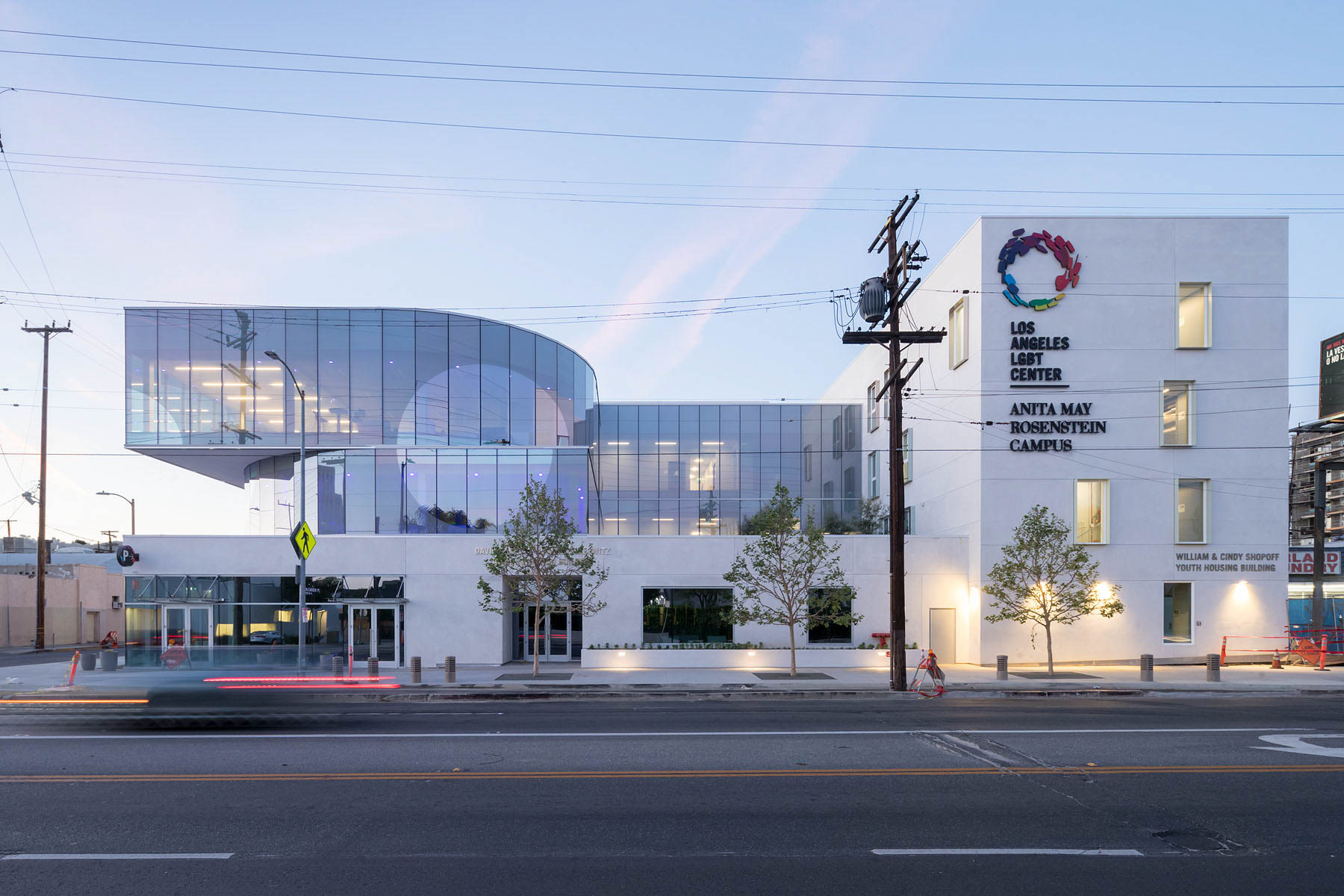 Photo of the Anita May Rosenstein Campus's street facade with glass and solid white forms