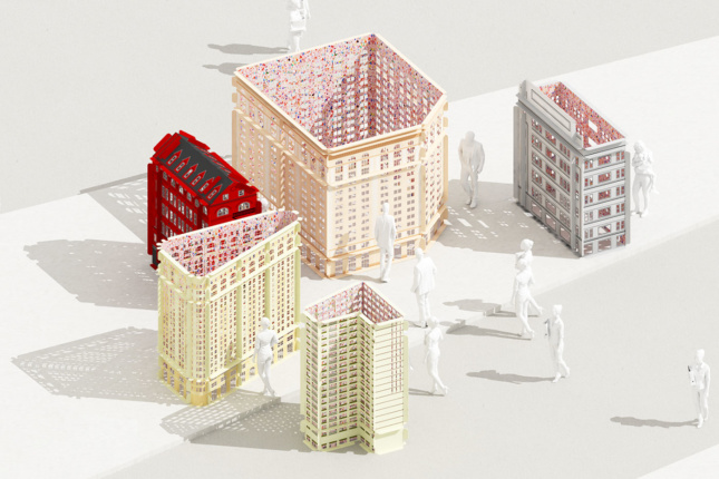 一张桌子上放着纽约熨斗区的建筑模型