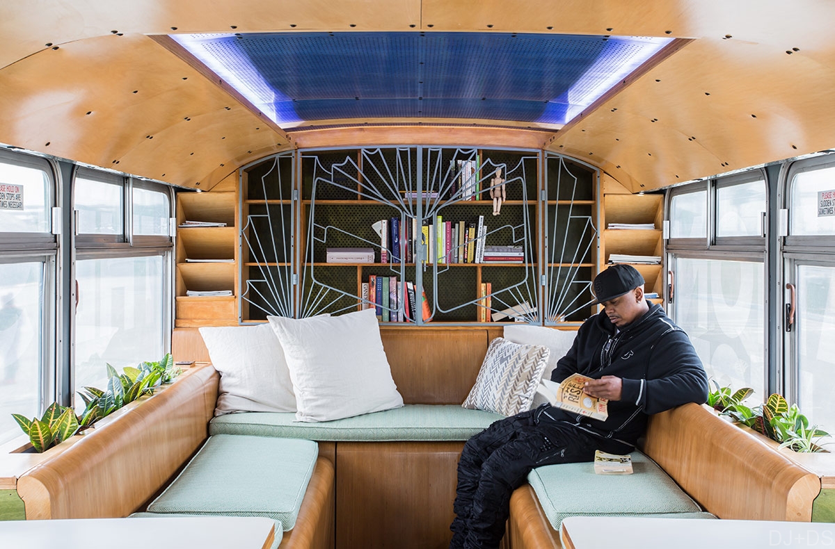 Interior of a plywood-clad mobile classroom from Designing Justice