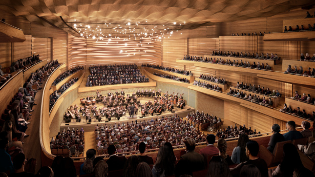 一个木制的音乐厅，有弯曲的形式，许多人坐着，纽约爱乐乐团正在表演