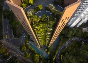 Looking down at EDEN tower in singapore, with planted balconies amid concrete slat walls