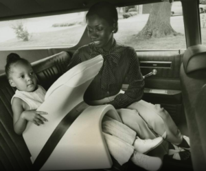 photo of a mother and daughter sitting in a car in 1973