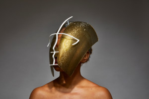 Photo of a person wearing the gold Egaro mask
