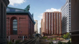 由高架铁路轨道和历史建筑环绕的住宅塔楼效果图