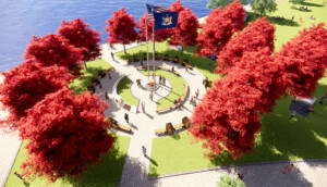 空中呈现the Essential Workers Park on the Hudson River, with the circle of heroes monument at its core