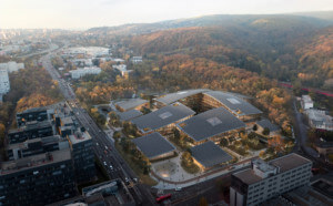 aerial view of a cybersecurity campus from BIG nestled at the base of a rolling mountain range