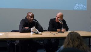 virgil abloh at a table with a sneaker