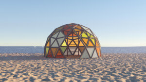 一个多色的圆顶结构，坐落在海滩上，作为冬季车站的一部分