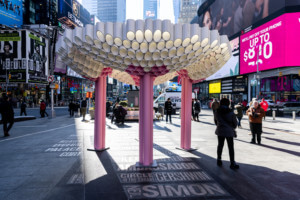 a temporary pavilion with pink columns installed at times square