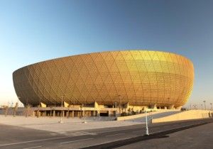 a large golden soccer stadium in qatar