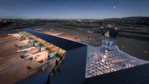 机场候机楼的俯视外景，设有玻璃中庭和空中交通管制塔。