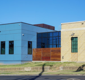 exterior of a bright blue addition at a planned parenthood clinic in austin