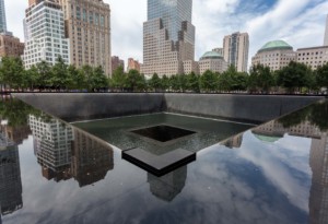 reflecting pool in front of city buildings